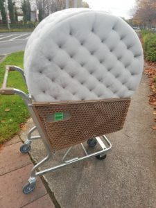 There is a lovely foot rest being carried in a large trolley. It says we all can tour Dublin